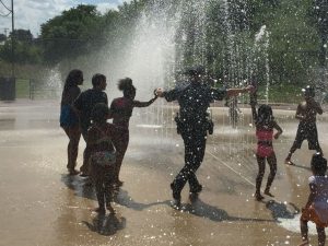 Coatesville's police sergeant Rodger Ollis joined the fun during the reopening of the city's splash pad. 