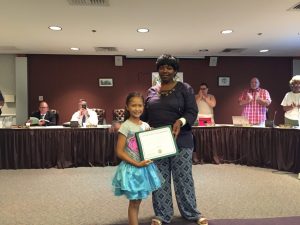 City council president Linda Lavender- Norris presented Ollis with an award in recognition of her efforts to beautify the city.