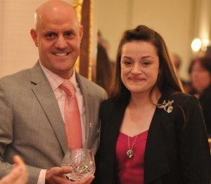 Rich Yoegel, co-chair of the American Red Cross Chester County Leadership Council, presents the Heroes bowl to Jessica Good, the widow of Chris Good, who was honored posthumously for his years of bravery and community service. Photo by 