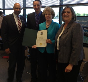 Ruth E. Kranz-Carl holds a certificate of commendation she received from Commissioner Terence Farrell (from left), Commissioners’ Chairman Ryan Costello, and Commissioner Kathi Cozzone.