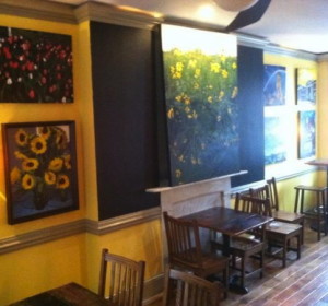 Paintings by West Chester artist John Hannafin will be on view at the new Roots Cafe.