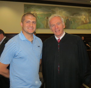 Chester County Senior Court Judge Thomas G. Gavin (left), who oversees the county’s Veterans Court, congratulates its newest graduate, Louis A. Freda II.