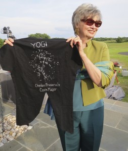 Natural Lands Trust board member Keith Pension shows off the star-themed outfit she created for Yogi, the preserve’s cocker spaniel mascot.