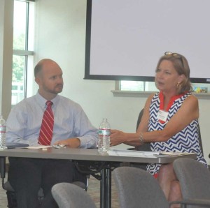 Claudia Hellebush, (right) the President of the United Way of Chester County and Brian Parsons, the Senior Vice President, Products, of West Chester-based Communications Test Design discuss the benefits of businesses giving back to the community, Wednesday.