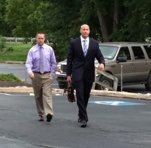 Gerald D. Pawling (left) is shown with his attorney, Daniel R. Bush, arriving for his arraignment last month in Caln district court.