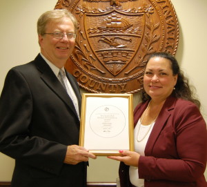 Chester County Chief Operating Officer Mark Rupsis (left) and Chester County Director of Finance Julie Bookheimer display the Government Finance Officers Association Distinguished Budget Presentation Award for 2013.