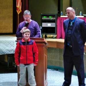 Rainbow Elementary School fifth grader Jonathon Thomas is honored for his work collecting school supplies to be donated to a school in Haiti, during Tuesday night’s Coatesville Area School Board meeting.