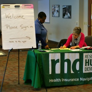 Resources for Human Development staff members monitor the sign in desk at the Brandywine Health Foundation building.