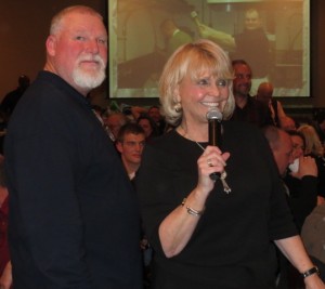 Chester County Sheriff Carolyn “Bunny” Welsh thanks the crowd for attending the Fifth Annual Wild Game Dinner as Deputy Sheriff Harry McKinney gets ready to continue operating the extensive raffle.