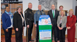 Chaya Scott (from left), executive director, Coatesville Youth Initiative; Chester County Commissioner Kathi Cozzone; Caln Township Police Chief Joseph G. Elias; Coatesville Police Chief Jack Laufer; Chester County District Attorney Tom Hogan; Chris Mulhall, chief of staff for Rep. Becky Corbin; Kathy L. Pape, president, Pennsylvania American Water; and Frances M. Sheehan, president and CEO, Brandywine Health Foundation, gather to announce the new initiative.