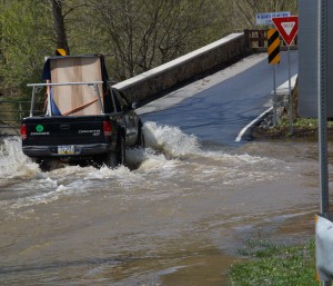 The driver of this truck was likely eager to get to higher ground on the bridge near the Northbrook Canoe Company in Pocopson Township. Photo by Dave Lichter