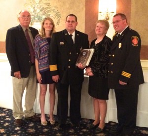 Surrounded by supporters, Scott Thornton (center) received the Nicholas H.S. Campbell Meritorious Service/EMS Leadership Award.