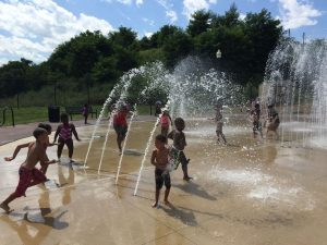 Coatesville residents enjoy cooling off at the newly reopened splash pad at the city's Riverwalk Trail.