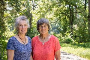 Sisters Patricia Kraus Holt and Kathryn K. McClure on the property they helped 