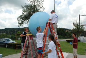 After stripping away layers of paint, cadets of PA-771 AFJROTC primed and painted the ocean of the globe at Veteran's Plaza in Coatesville's Gateway Park.