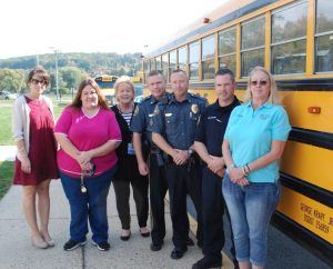 Operation Safe Stop, in conjunction with National School Bus Safety Week, took place Wednesday with the Coatesville Police Department and Krapf Bus Company. From left to right: Lori Aguilera, Director of the Chester County Highway Safety Project, Danyel Stutzman a bus driver with Krapf, Stephanie Mitchell, an operations manager with Krapf, Lt. James Audette, Sgt. Rodger Ollis, Officer Robert Kuech and Sue Liskey, a safety officer with Krapf.