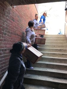 An assembly line was formed from the back alley of the West Chester Y to the basement to deliver 1,482 coats to be distributed to children in need.