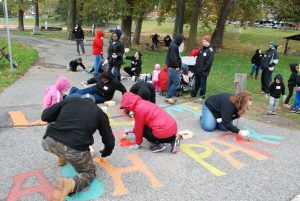 Svereal volunteers helped collect trash, rake leaves and repaint inspiring words and games for the Born Learning Trail at Ash Park. 