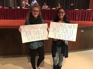 Coatesville senior Meghan Atwell (left) pictured with senior Nia Giordano showed support for the teachers of the Coatesville Area School District at the school board meeting last week.