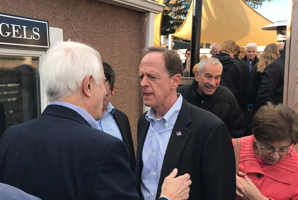 U.S. Senator Pat Toomey speaks with supporters immediately after his campaign event Monday morning at the Classic Diner in Malvern.