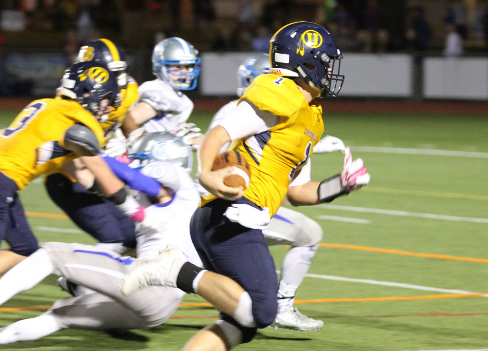 Unionville's Joe Zubillaga finds running room to the right on what would be the winning touchdown with less than a minute to go. Jim Gill photo.